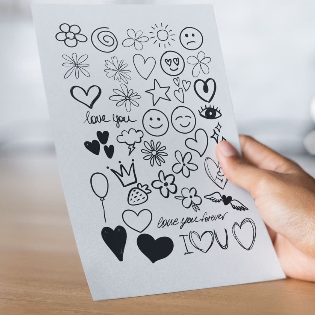 Minimalist collection of 39 hand-drawn black doodle clipart icons including hearts, stars, flowers, arrows, and simple shapes for digital and printable crafting.