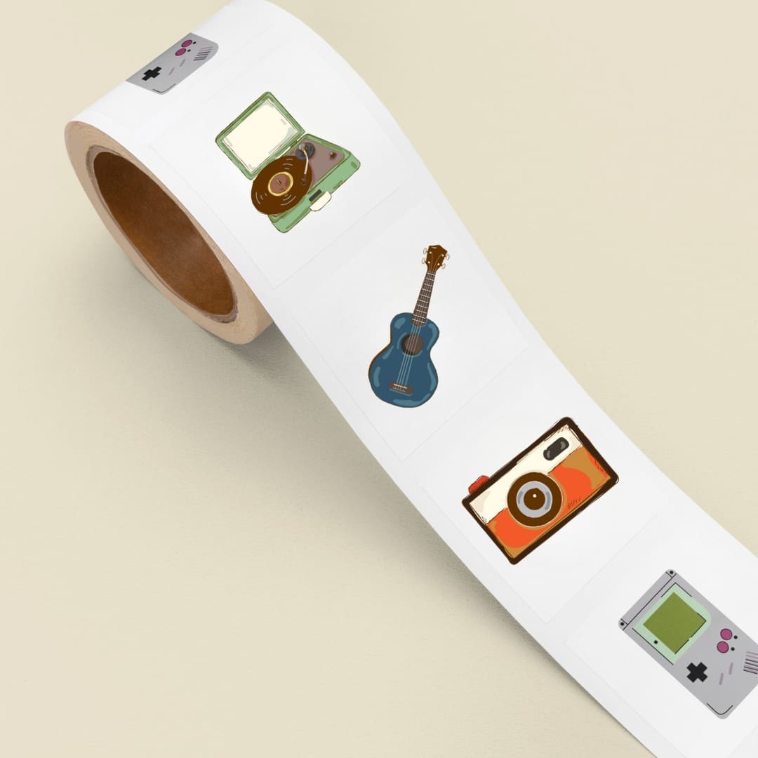 Digital sticker sheet titled Born in the 90’s featuring colorful retro illustrations, including a cassette tape, record player, guitar, scooter, vintage phones, sunglasses, Game Boy, slinky, Rubik’s Cube, old TV, camera, floppy disk, and denim pants on a beige background