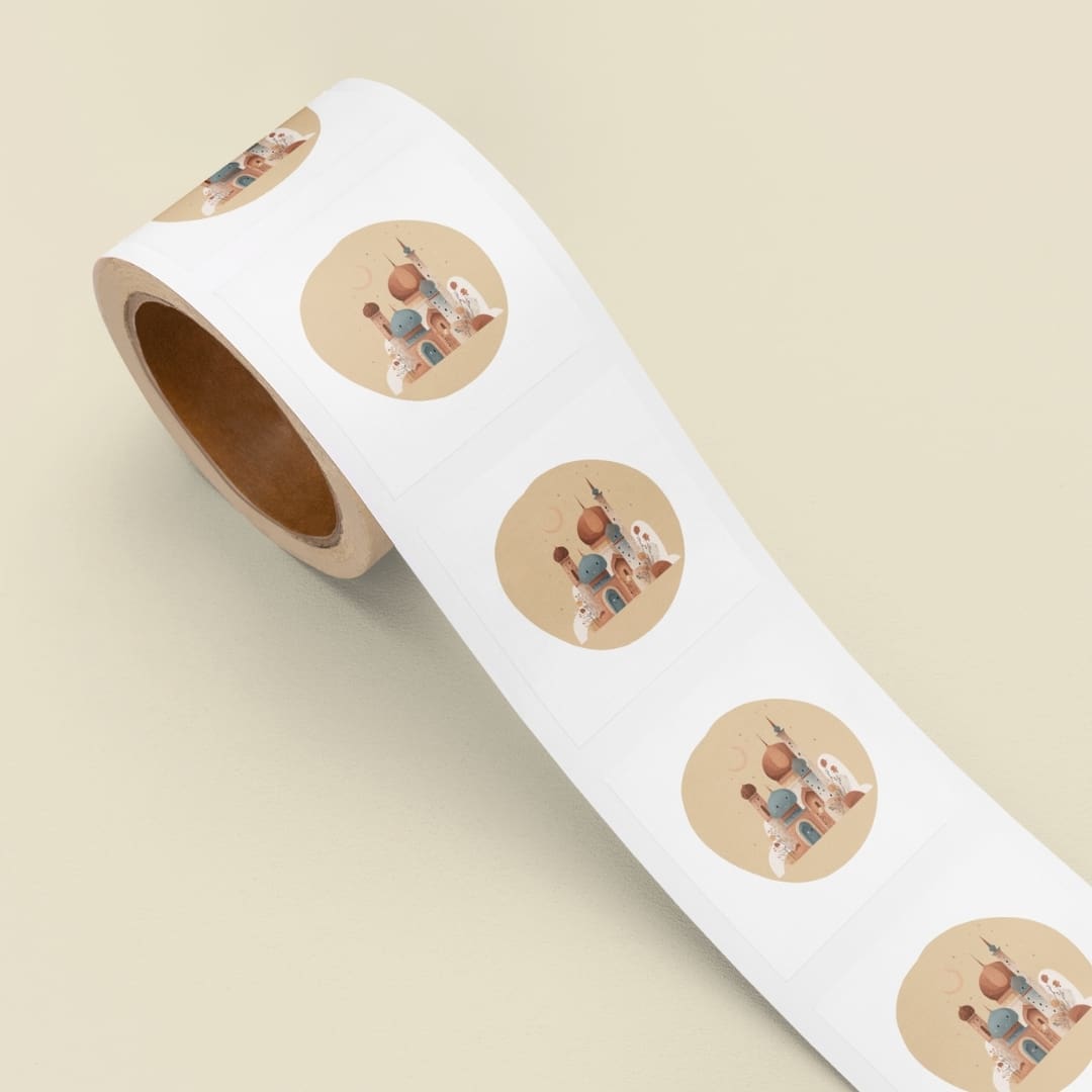 Sheet of 22 Ramadan-themed circular stickers arranged in a grid, featuring crescent moons, lanterns, mosques, camels, dates, Arabic coffee pots, and a Qur’an illustration in soft beige and blue tones on a neutral background