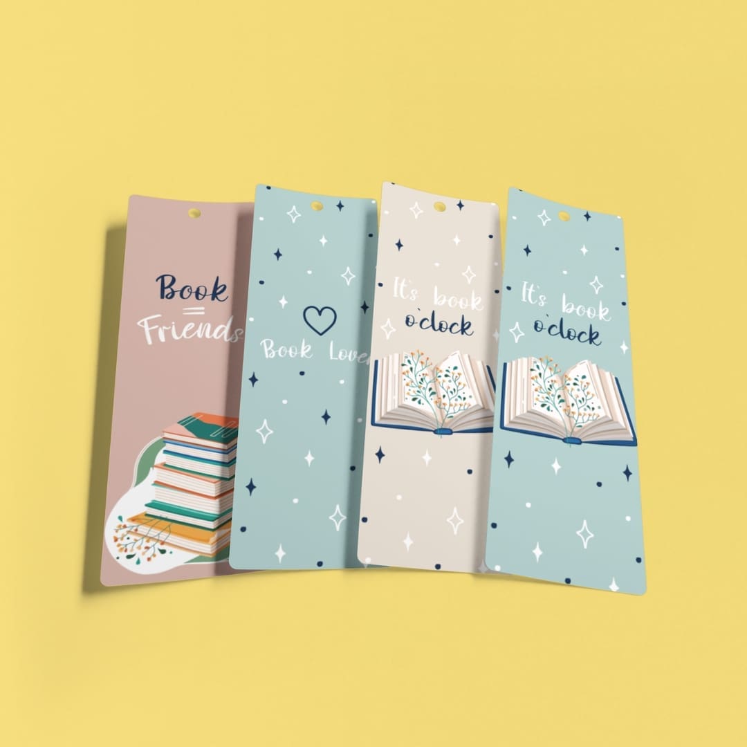 Set of six Soft Studio printable bookmarks in soft pastel colors featuring book-themed illustrations and quotes like “Book Lover,” “Book = Friends,” and “It’s book o’clock,” arranged vertically on an A4 layout with cozy star details and stacked book graphics.
