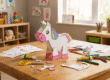 Cardboard unicorn craft for kids with crayons, glue, scissors, and printable templates for screen-free family activity at home